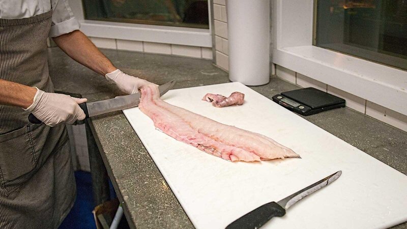 Staff preparing fresh fish